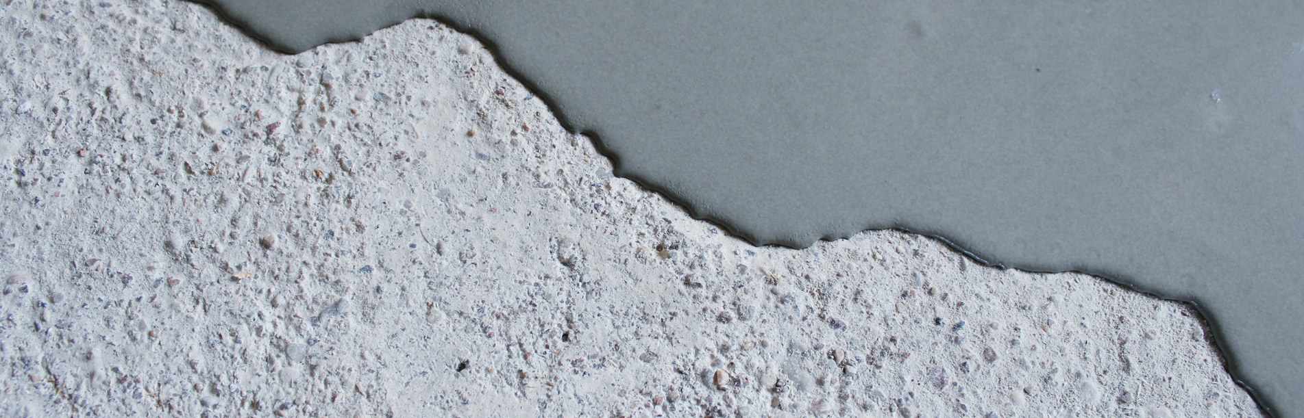 Concrete background. Self leveling compound spreading. Concrete background. Self leveling compound spreading.